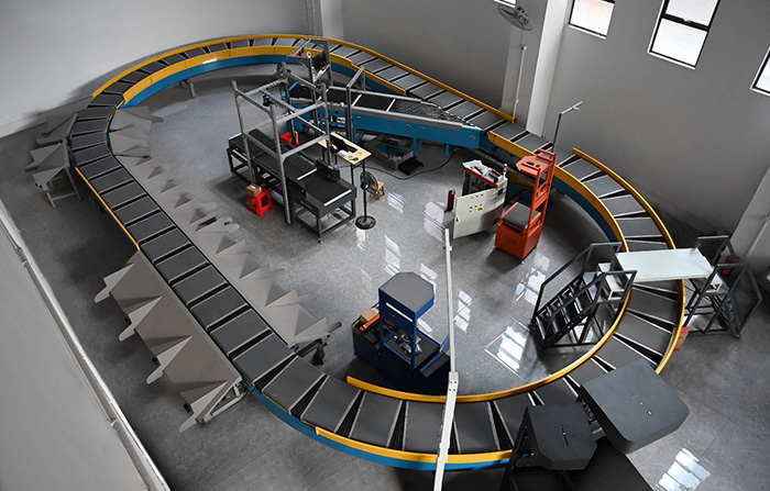 環(huán)型交叉帶分揀機的工作原理、特點及應用